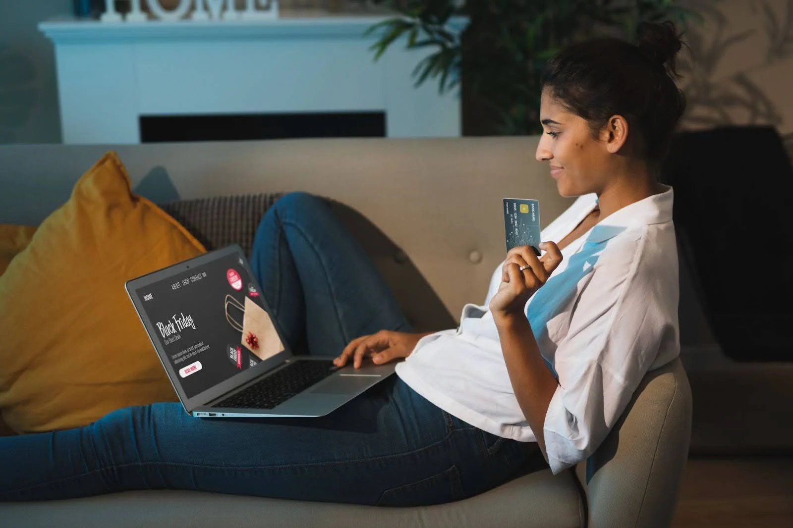 Lady using a laptop and holding a credit card, representing Comcast Internet Plans in Santa Ana designed for Santanans seeking speed, savings, and seamless streaming.