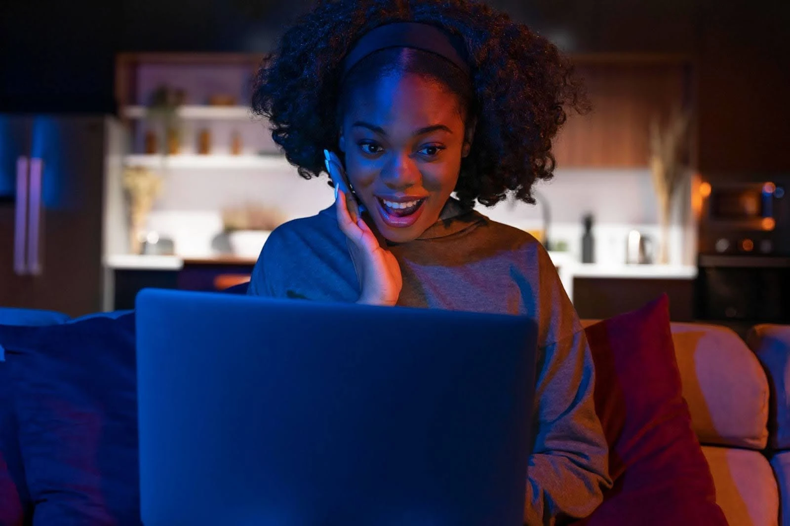 Young woman browsing the internet on her laptop, representing Xfinity internet plans in Mechanicsburg that prevent slow connections, frozen screens, and buffering issues.