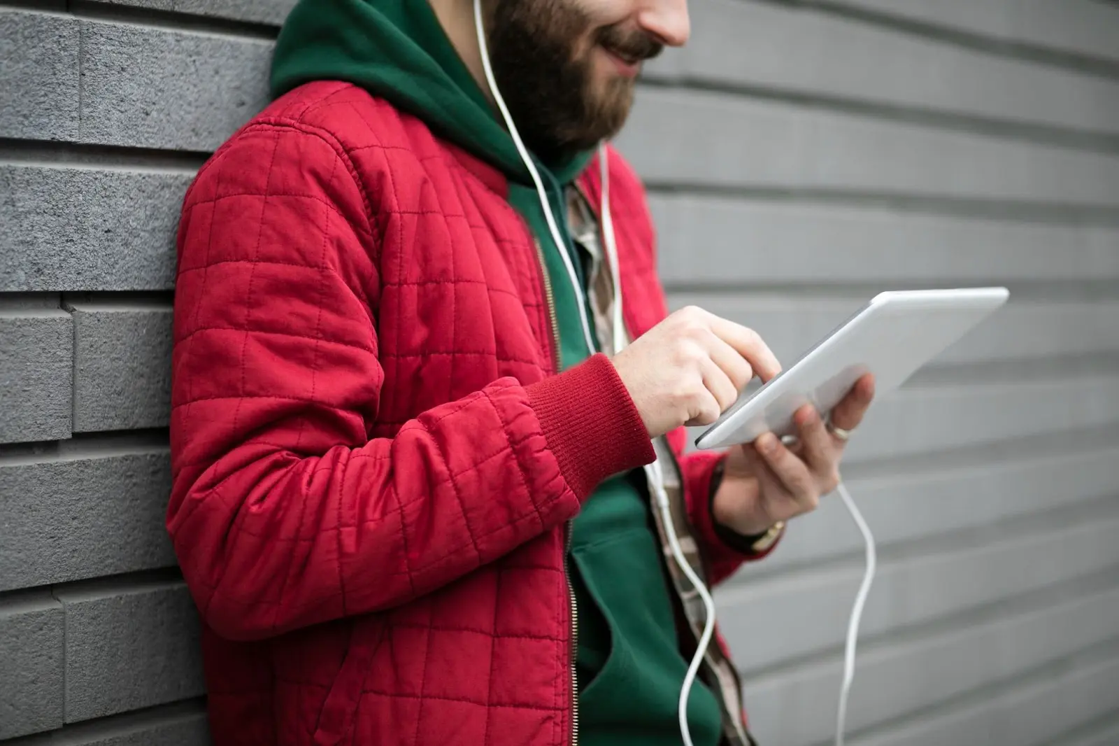 Man using a tablet to browse the internet, representing Windstream's Kinetic internet service.