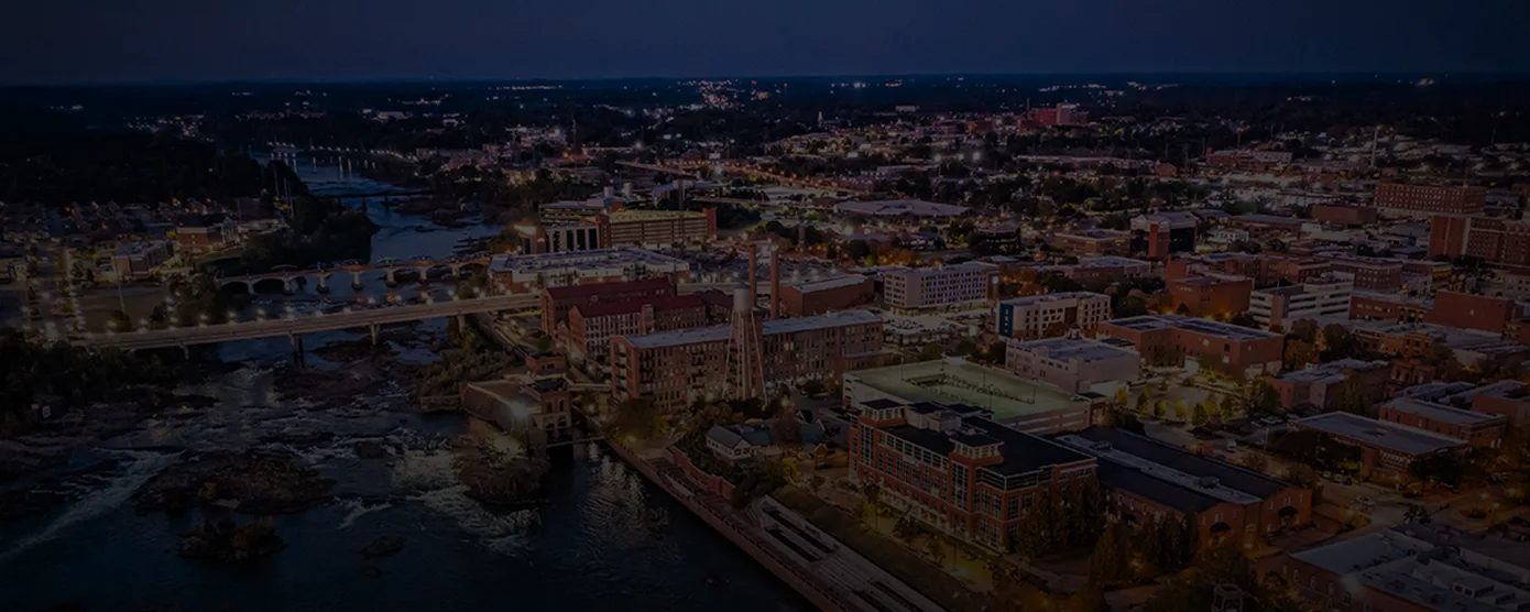 Night aerial view of downtown Columbus, Georgia with city lights and skyline, representing reliable Internet Providers in Columbus, GA for fast and consistent connectivity.