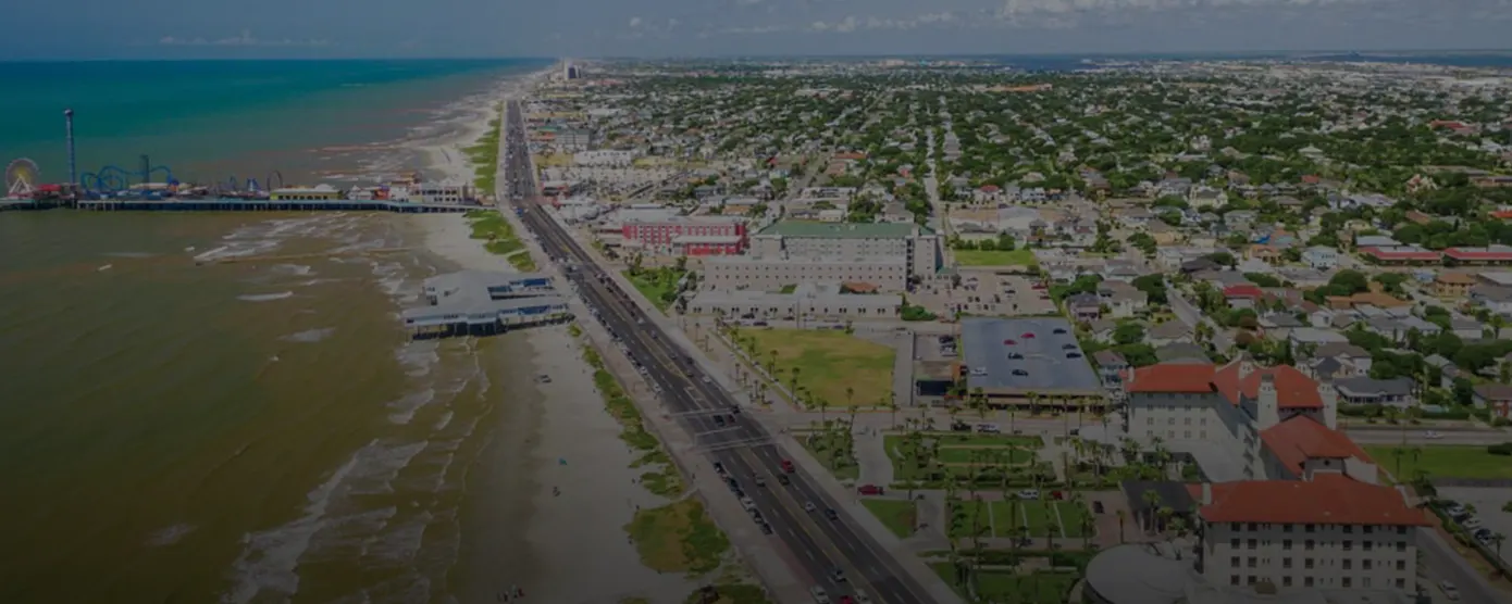 Aerial view of Galveston, Texas, featuring the coastline, city layout, and Gulf waters, used as a banner image for internet providers in Galveston, TX.