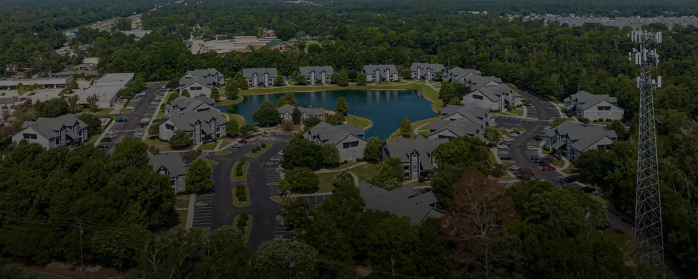 Aerial view of Pelican Pointe Apartments in Slidell, Louisiana, surrounded by residential buildings and greenery, representing the best internet providers in Slidell, LA.