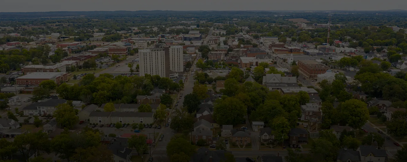 Aerial view of Bowling Green, Kentucky showing residential neighborhoods and commercial areas, representing fast and reliable internet coverage across the city. Text overlay reads: "Compare Internet Providers in Bowling Green, KY – The Fastest Speeds - Guaranteed."