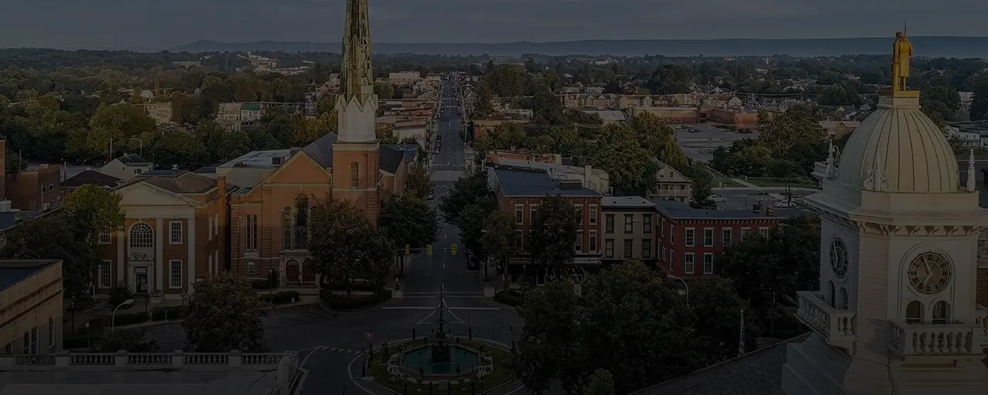 Aerial view of Chambersburg, Pennsylvania, featuring city layout and landscape, banner image for “Internet Providers in Chambersburg, PA – Compare Plans with Talk Walk Connection.