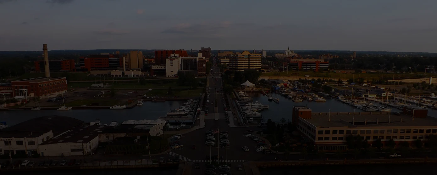 Aerial view of Erie, Pennsylvania, featuring downtown buildings, residential areas, and Lake Erie shoreline, representing internet providers and reliable connectivity in Erie, PA.