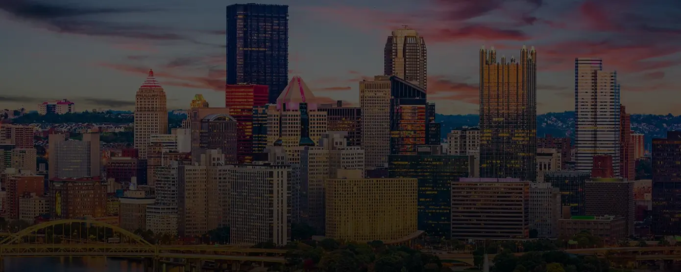 Aerial skyline view of Pittsburgh, Pennsylvania, featuring downtown high-rise buildings, rivers, and bridges, representing the best internet services in Pittsburgh.