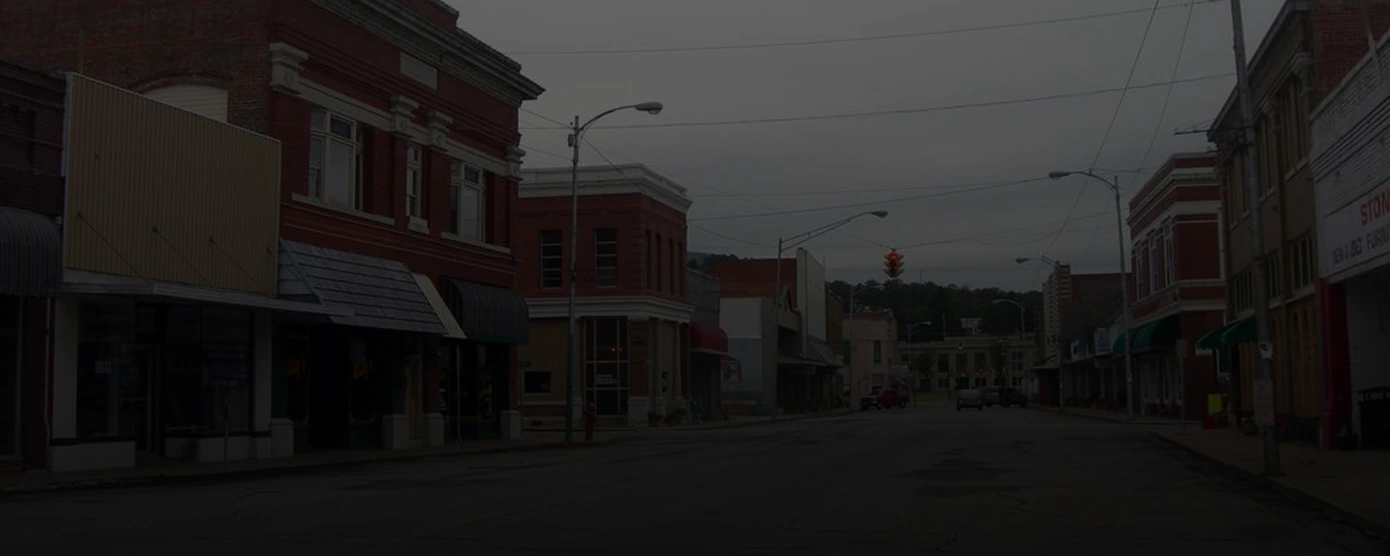Scenic view of Poteau, Oklahoma with residential areas and surrounding greenery, representing local internet options – banner for 'Internet Providers in Poteau, OK – Talk Walk Connection’s Guide'