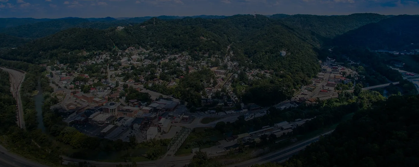 Aerial view of Hazard, Kentucky, showcasing the city’s landscape with buildings, roads, and surrounding green hills — representing the local community for the topic “Internet Providers Hazard, KY: The Real Deal for Speed, Price & Reliability.”